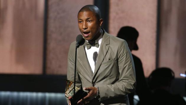 Pharrell Williams accepts the award for best pop solo performance for "Happy" at the 57th annual Grammy Awards in Los Angeles